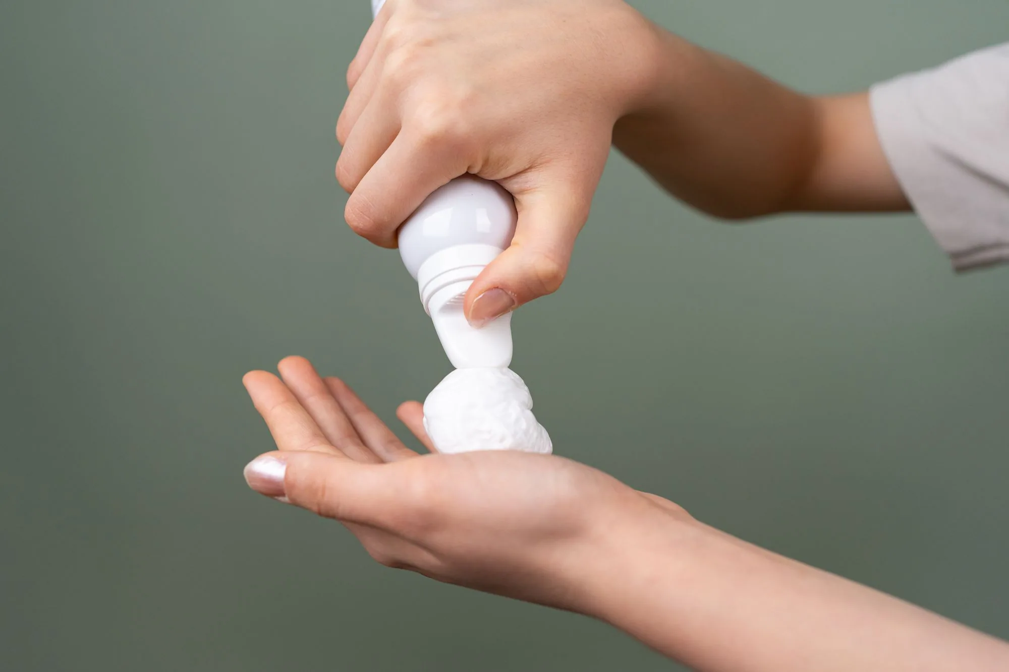Preparing shaving foam from dispenser for grooming close-up. Editorial photograph for our millilitres guide for Dubai shoppers.
