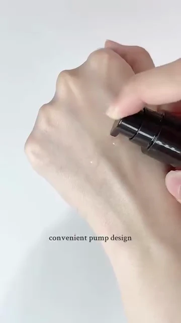 The real Balancing Oil Essence texture demonstrated on a hand