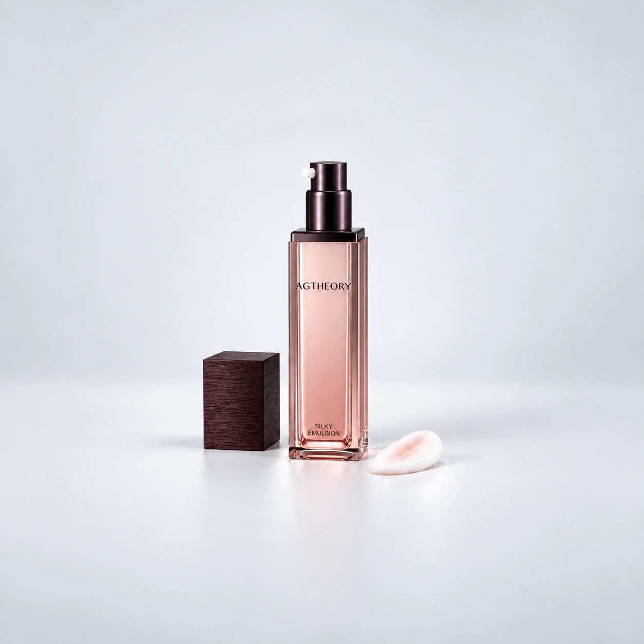 AGTHEORY Silky Emulsion 55mL — bottle with the pump exposed and cap beside it on a gray background